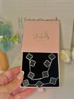 Load image into Gallery viewer, Black and Silver Clover Jewelry Set: Necklace, Earrings, and Bracelet
