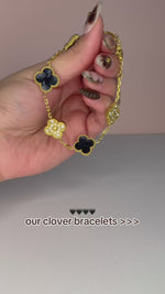 Load and play video in Gallery viewer, Black and Gold Clover Stainless Steel Jewelry Set: Necklace, Earrings, Bracelet
