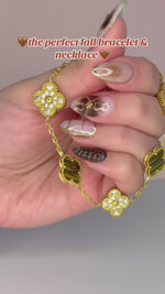 Load and play video in Gallery viewer, Brown &amp; Gold Clover Jewelry Set: Necklace, Earrings, and Bracelet
